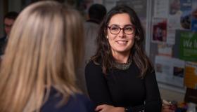 Two females engaged in conversation