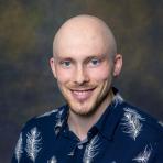 Headshot of Nick Caddick