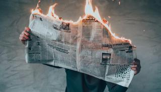 Newspaper on fire