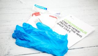 NHS leaflet and surgical gloves