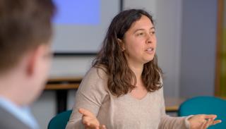 PhD student presenting at a workshop