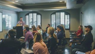 Man speaking at a seminar