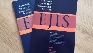 Copies of EJIS on a coffee table