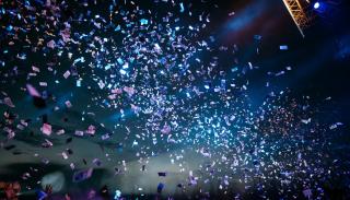 A stream of party poppers at a concert