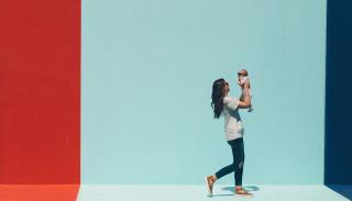 Woman holding up baby in France