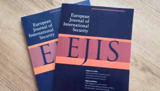 EJIS journals on a coffee table