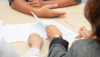 Papers displayed in a businesslike interview