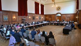 Students taking part in the BISA climate sim 2023 at Goodenough College in the Great Hall