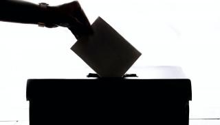 A ballot being dropped into a ballot box