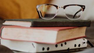 Glasses on a pile of books