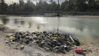 A pile of waste on a beautiful beach