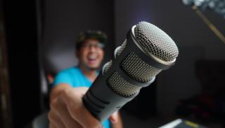 Man pointing a microphone