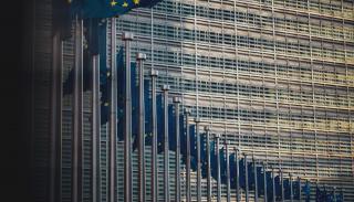 EU flags outside building in Brussels