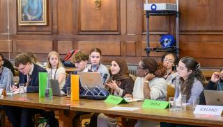 A group of students sat at a table at the BISA climate change event