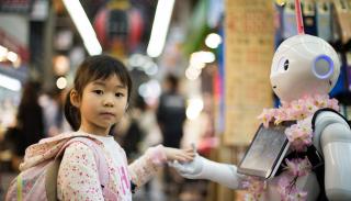 A little girl with a robot