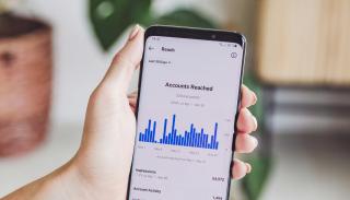 A social media analytics graph on a phone