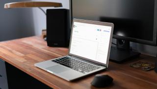 A laptop on a wooden desk