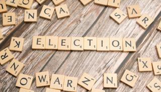 Scrabble letters arrange to make the word 'election'