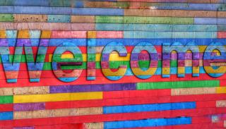 Multicoloured sign that says welcome