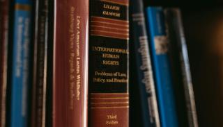A row of books entitles 'international human rights law'