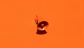 Orange megaphone on an orange background