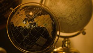 softly lit room with 2 different globes