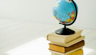 A globe set upon a stack of books