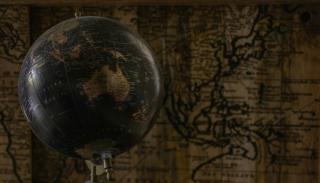 A globe against a map 