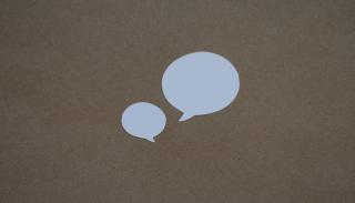 brown background with 2 white speech bubbles