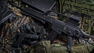 Black rifle with bullets and other accessories