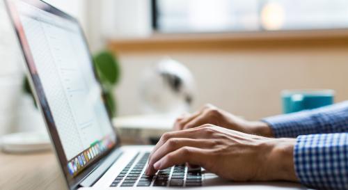 Male hands on laptop