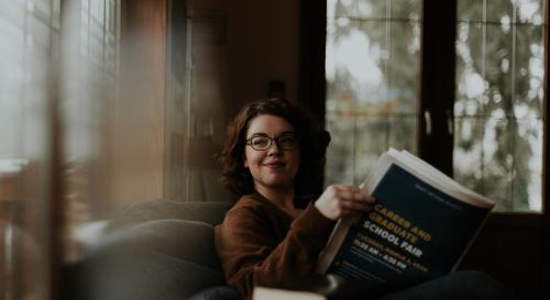Student reading a careers newspaper