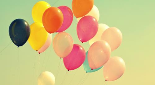 Balloons in a green sky