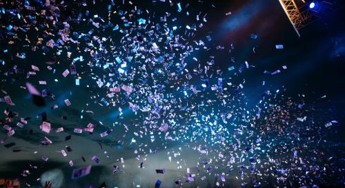 A stream of party poppers at a concert