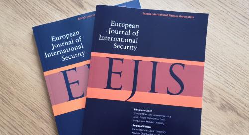 EJIS journals on a coffee table