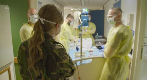 military and hospital staff working together