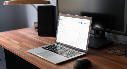 A laptop on a wooden desk