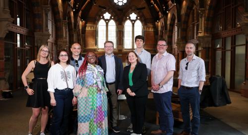 Speakers and organisers of the BISA PG/ECR day 2025 in the atrium at Queen's University Belfast Graduate School