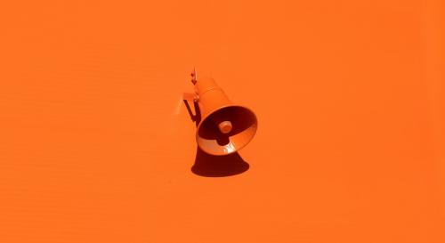 Orange megaphone on an orange background