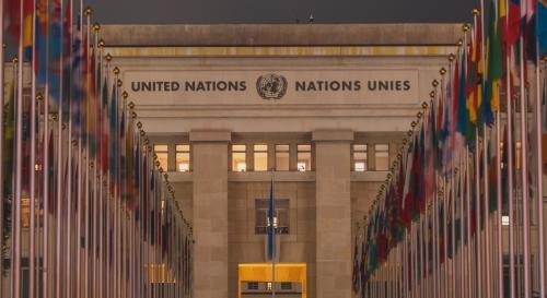 front of the UN European headquarters lined with flags