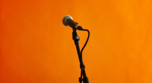 microphone on an orange background