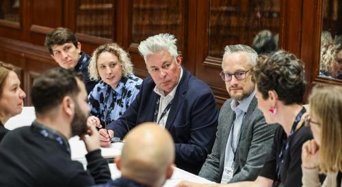 A group of BISA trustees having a meeting round a table