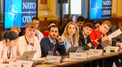 Students sat around a table at the 2026 BISA/FCDO Model NATO
