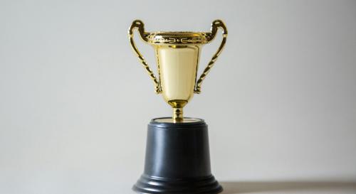 Gold trophy on a white background