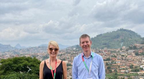 Erin Hannah and James Scott in front of the Cameroon skyline