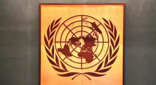 Gold and brown painting of the United Nations logo 
