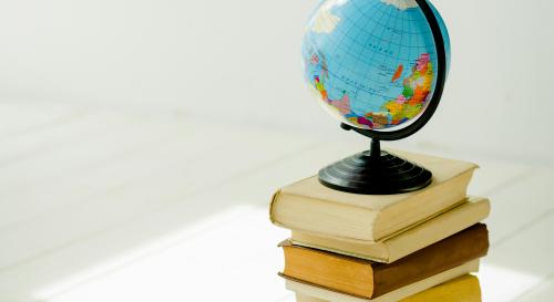 A globe set upon a stack of books