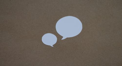 brown background with 2 white speech bubbles